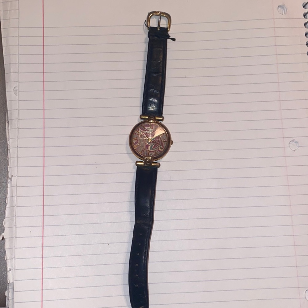 Fossil watch with black wrist band.